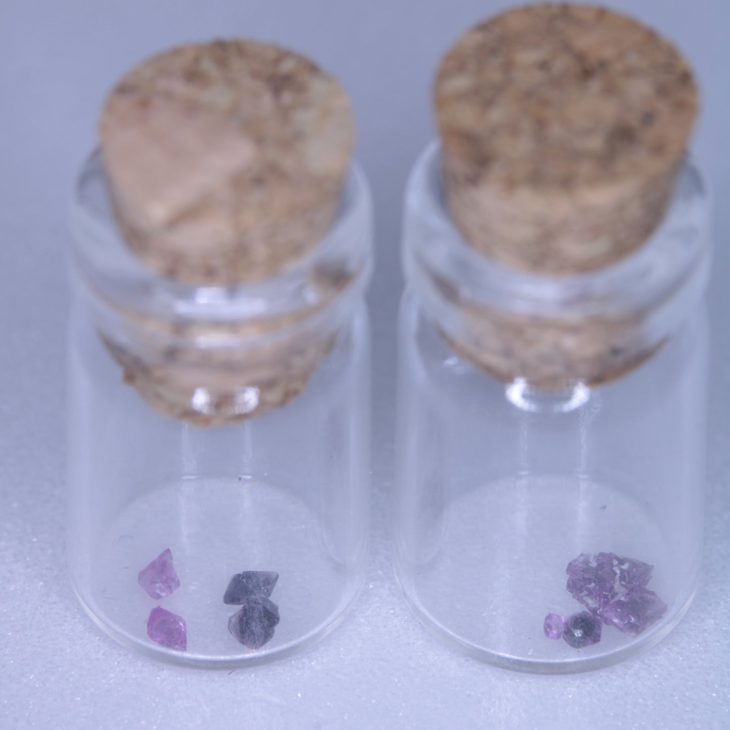 A glass vial containing flux grown rubies