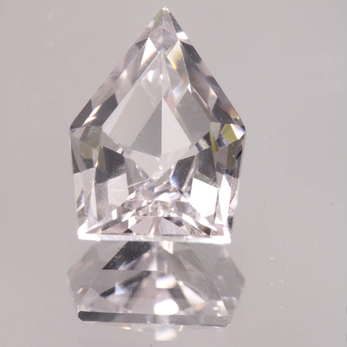 faceted Pink EOTS Cut sapphire gem made from F-35 window sapphire