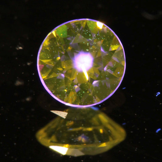 Faceted Round Ce/Nd YAG Gemstone with “Bullseye” Pink Fluorescence in the Yellow Crystal