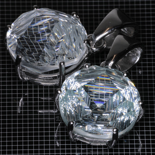 Fantasy Cut Light Blue Yb:YAG gemstones in sterling silver pendants