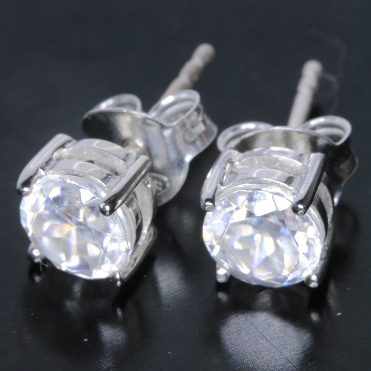 Faceted Lithium Niobate Earrings on a black background