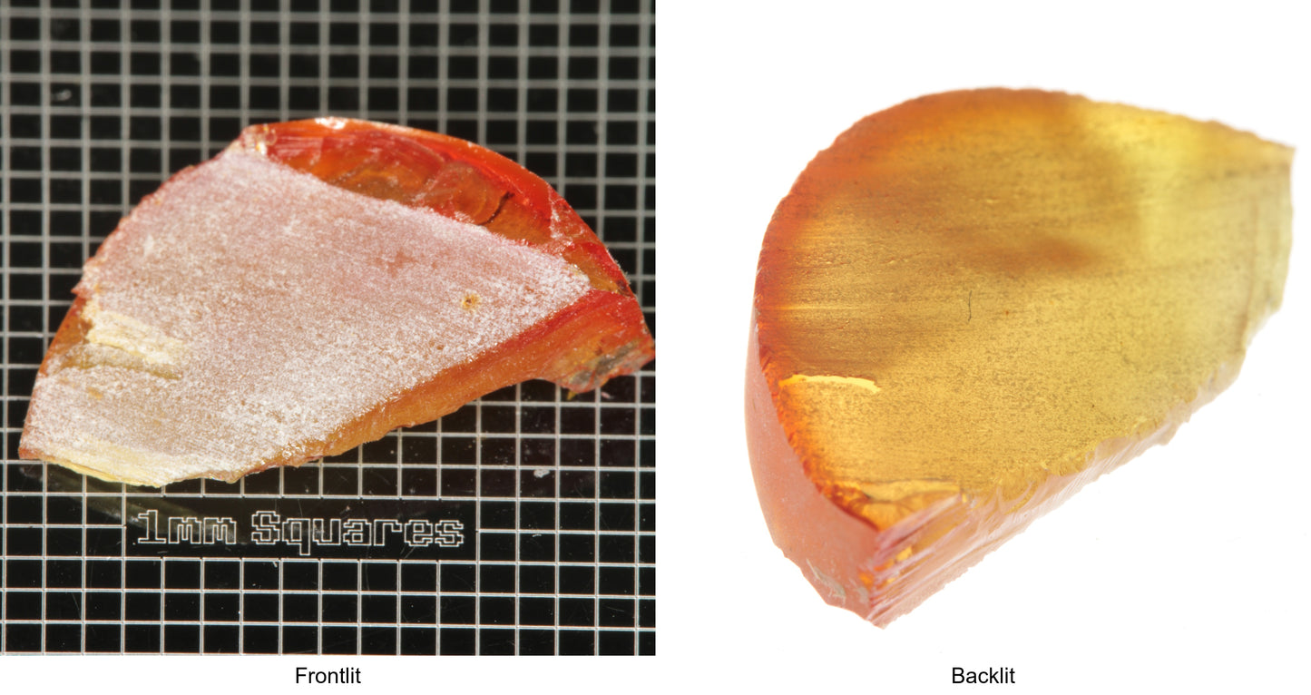 Rough Orange Flame Fusion Sapphire, Shard Shaped Piece shown in both normal light and backlit.