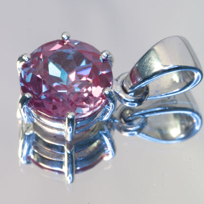 Lab Alexandrite Pendant in sterling silver, 10mm round showing multicolors due to multiple lights.