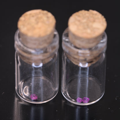 A glass vial containing flux grown rubies