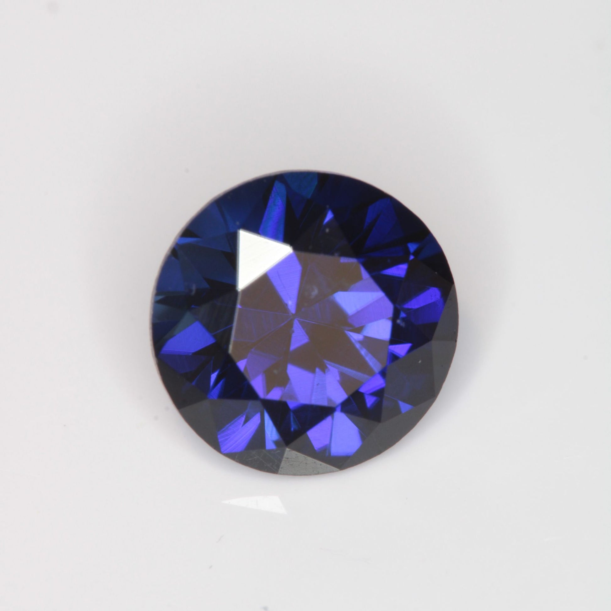 Faceted Flame Fusion Blue Sapphire Round Gemstone