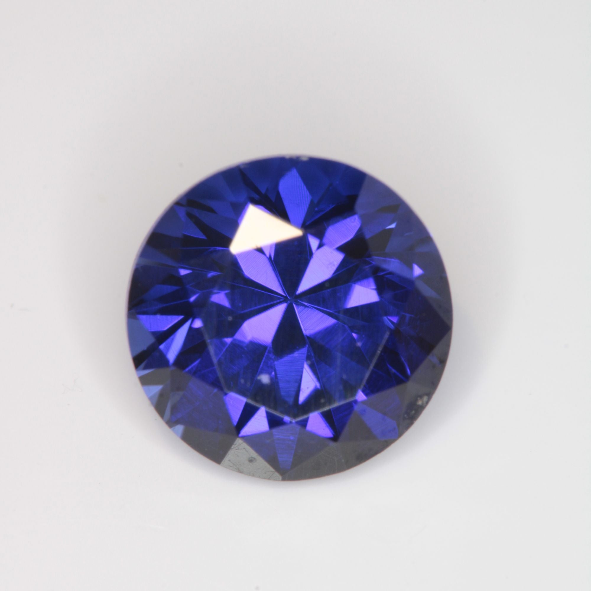 Faceted Flame Fusion Blue Sapphire Round Gemstone