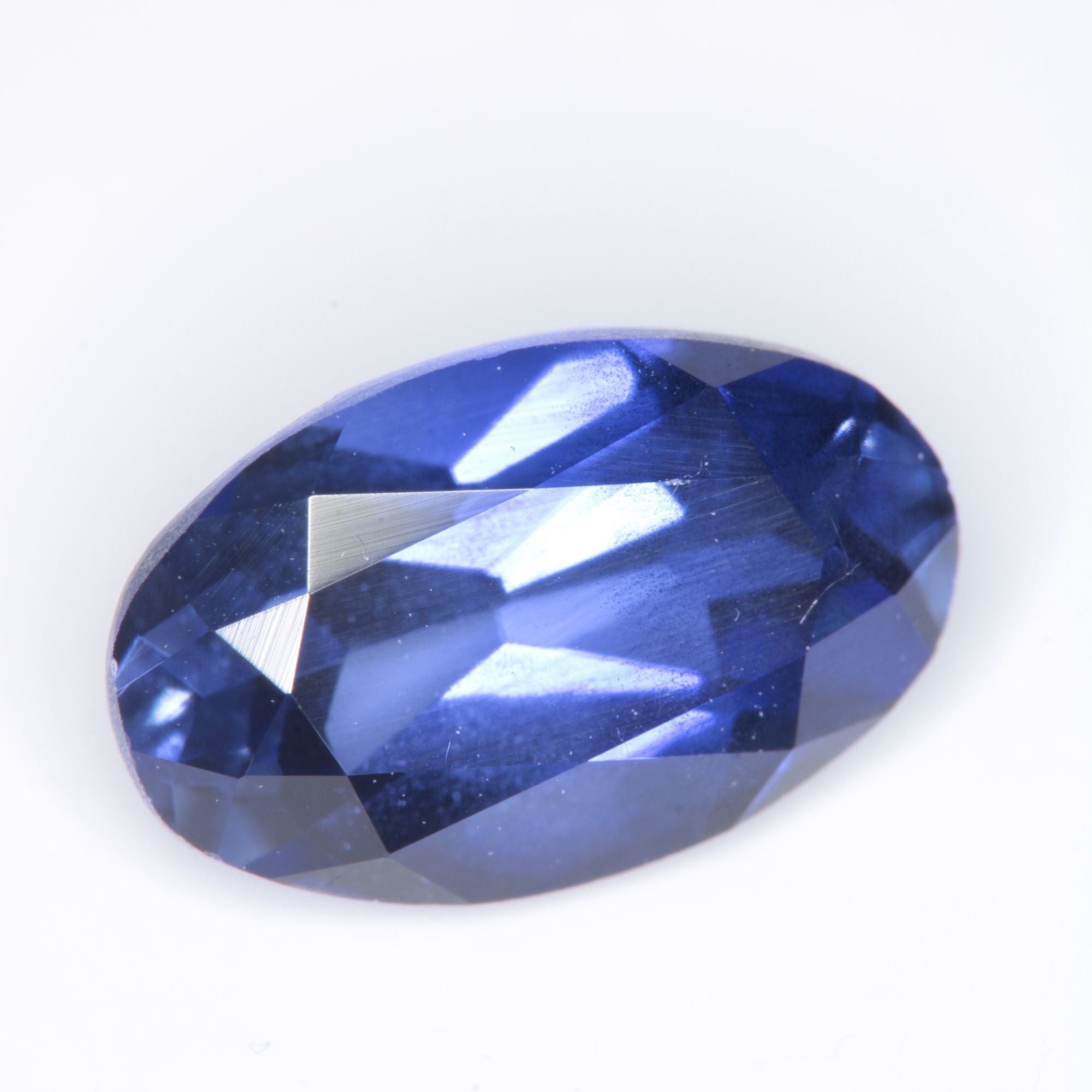 Faceted Flame Fusion Blue Sapphire Oval Gemstone