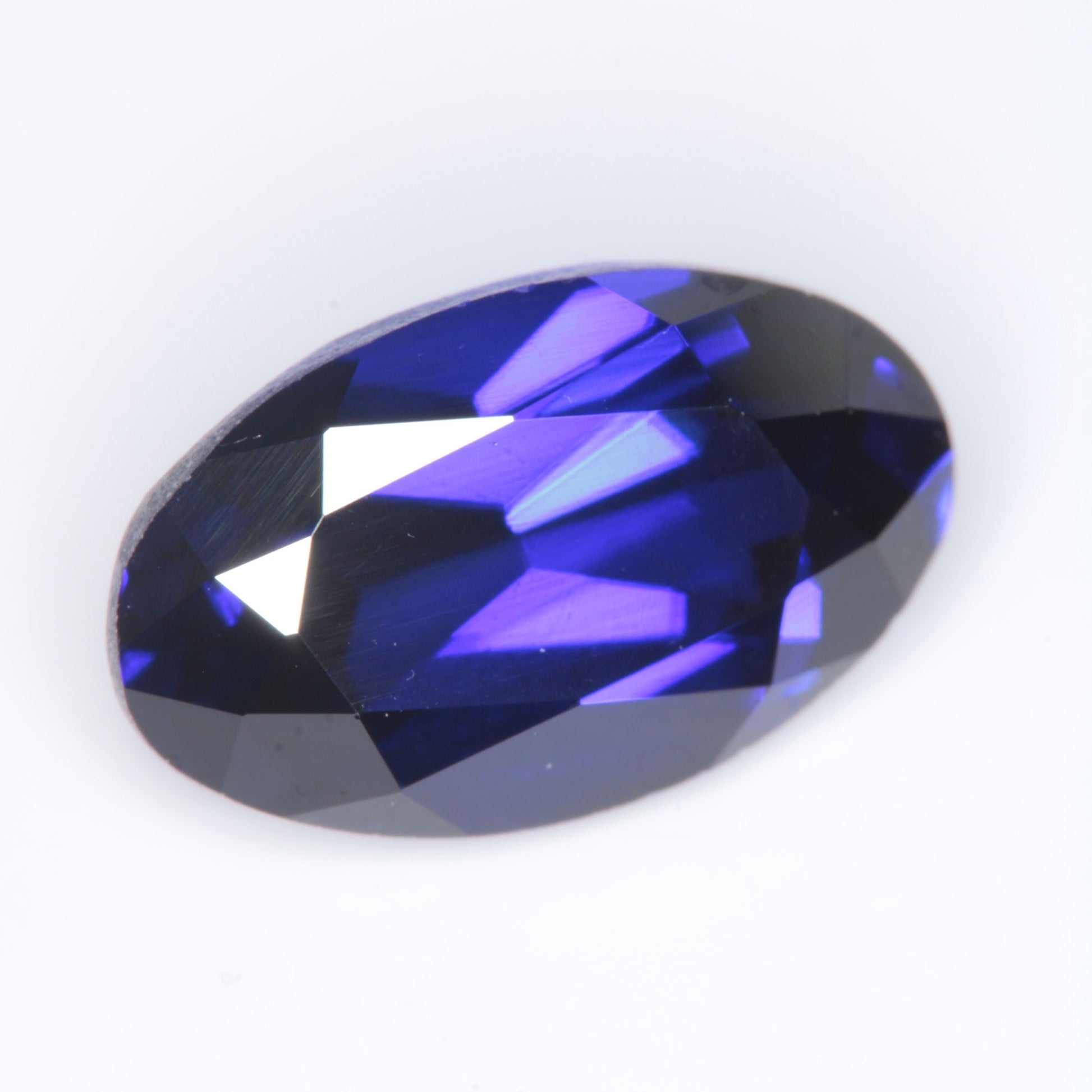 Faceted Flame Fusion Blue Sapphire Oval Gemstone