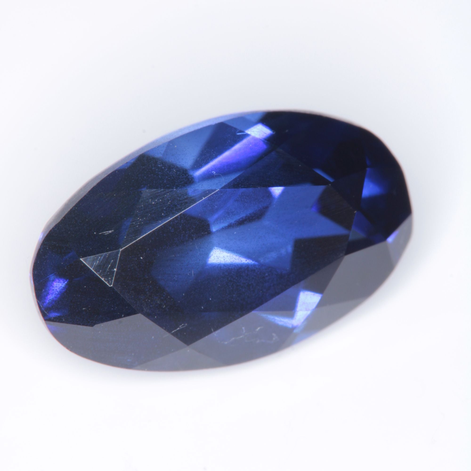 Faceted Flame Fusion Blue Sapphire Oval Gemstone