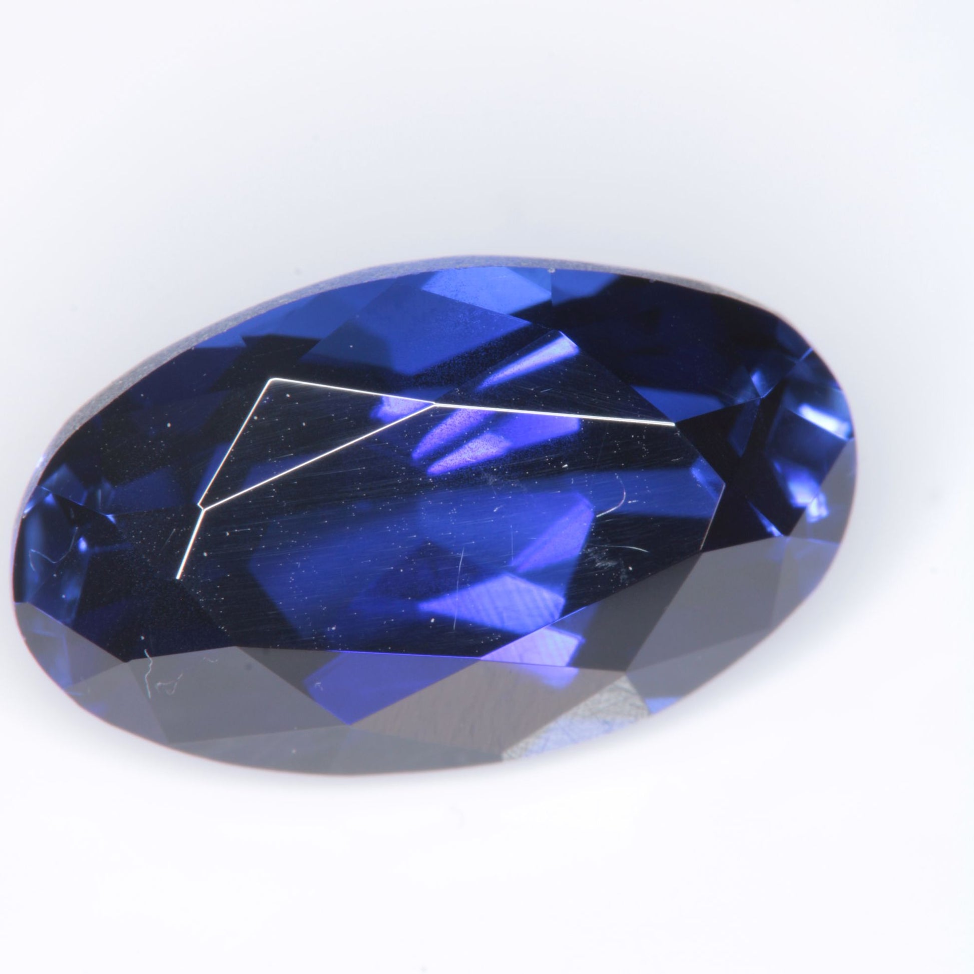 Faceted Flame Fusion Blue Sapphire Oval Gemstone