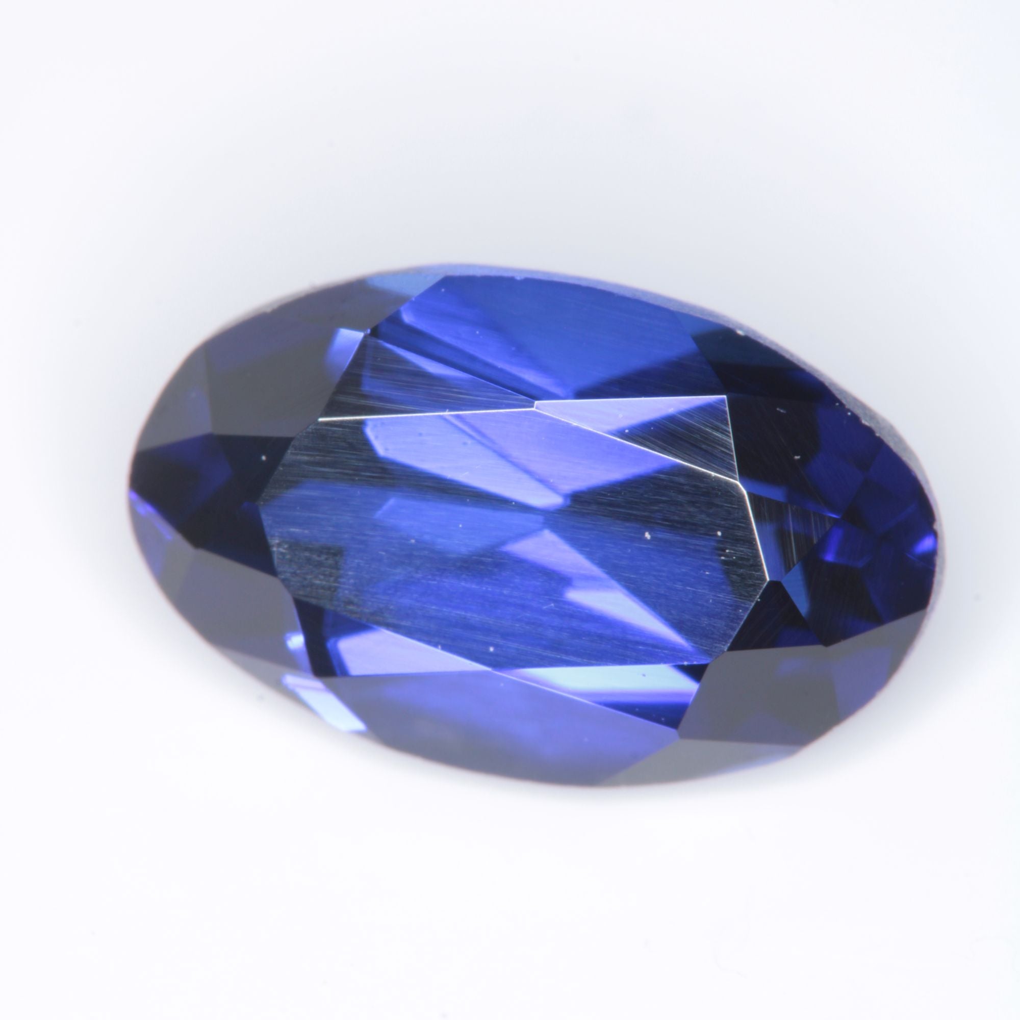 Faceted Flame Fusion Blue Sapphire Oval Gemstone
