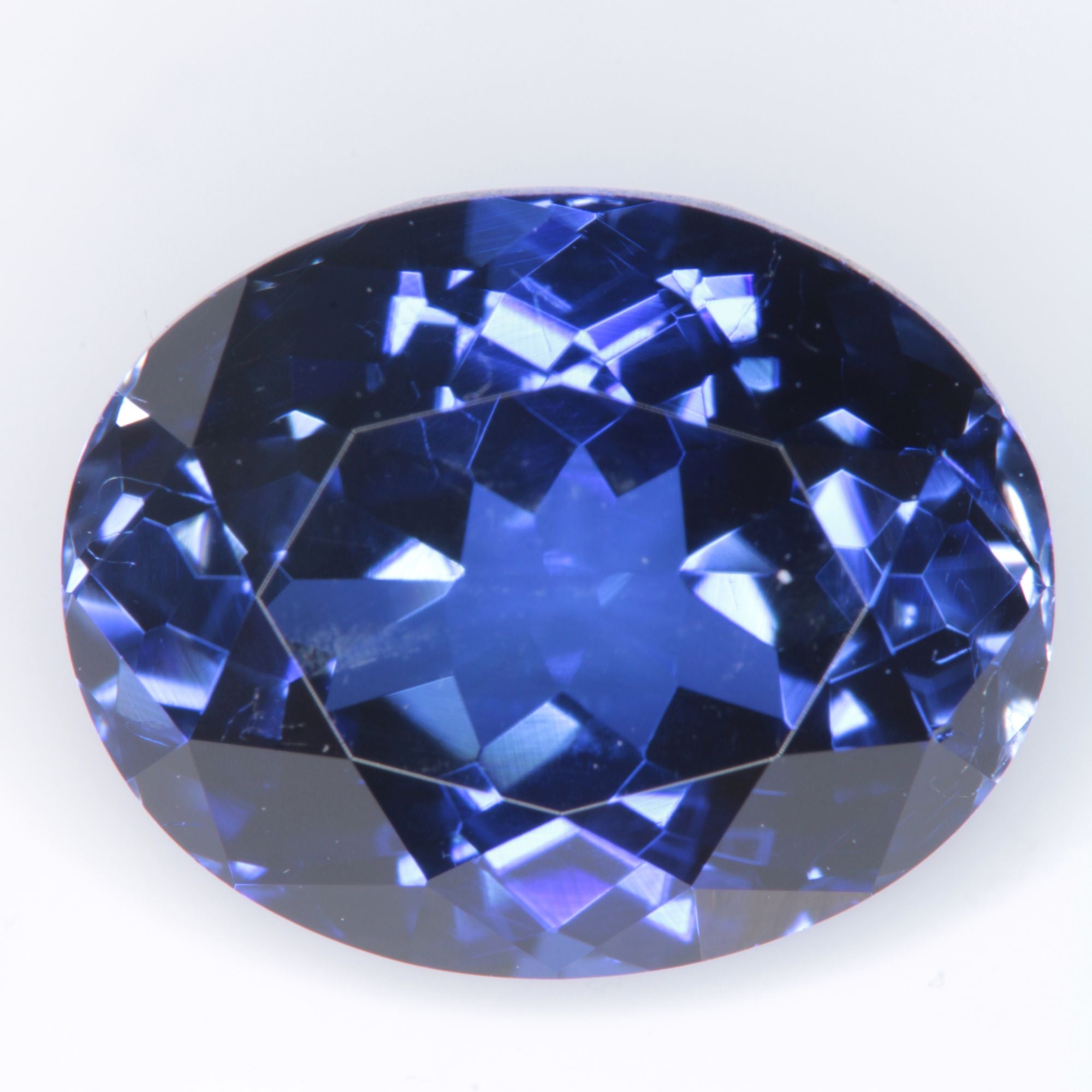 Faceted Flame Fusion Blue Sapphire Oval Gemstone