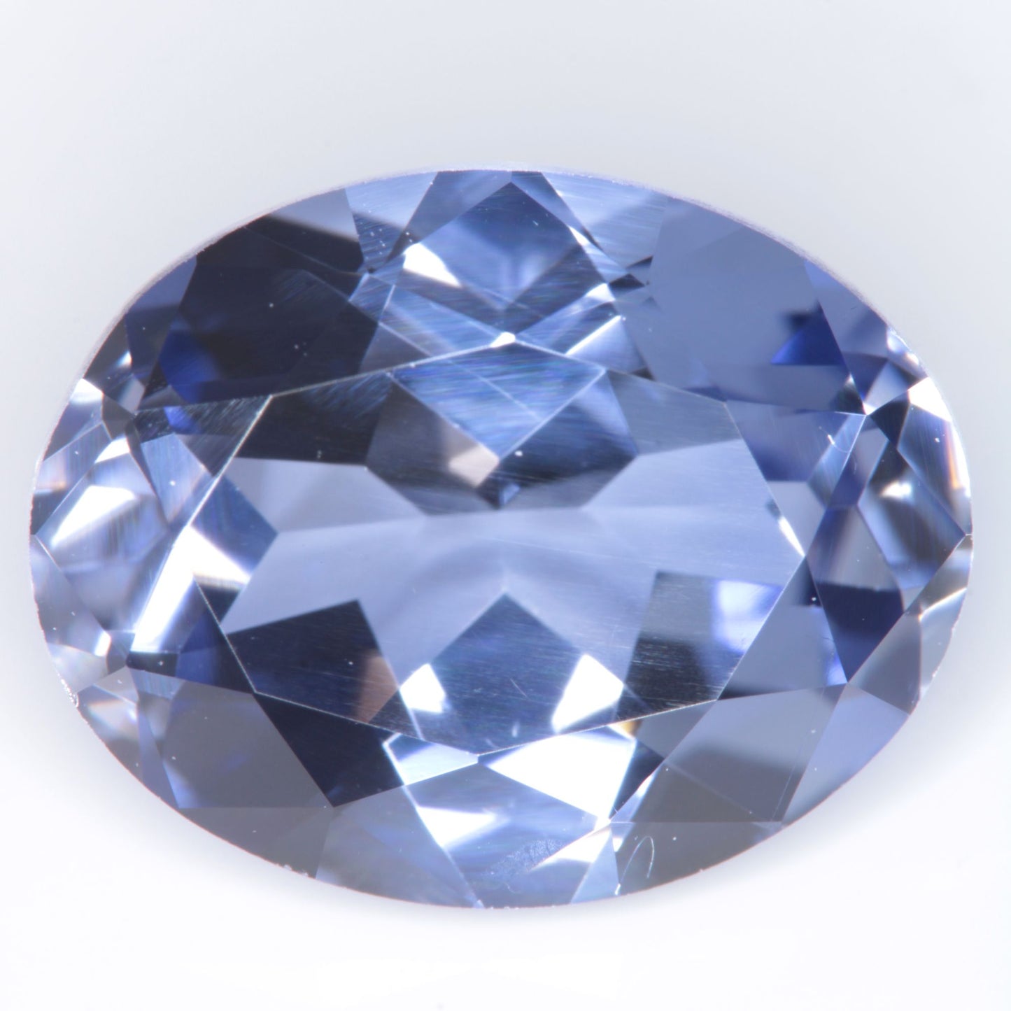Faceted Flame Fusion Blue Sapphire Oval Gemstone