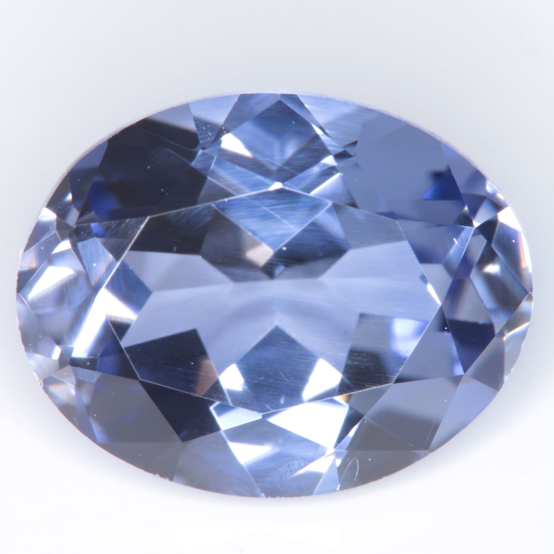 Faceted Flame Fusion Blue Sapphire Oval Gemstone