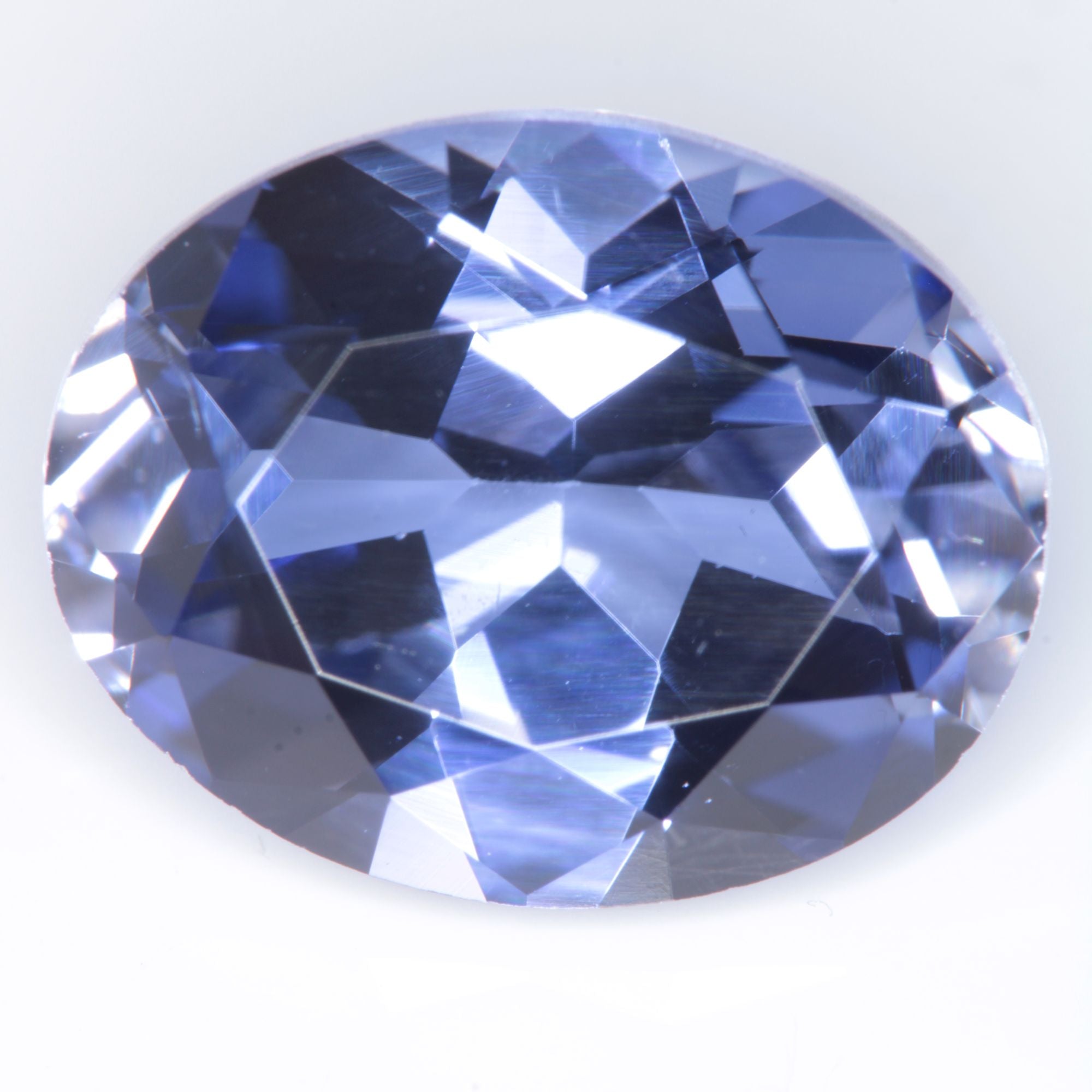 Faceted Flame Fusion Blue Sapphire Oval Gemstone