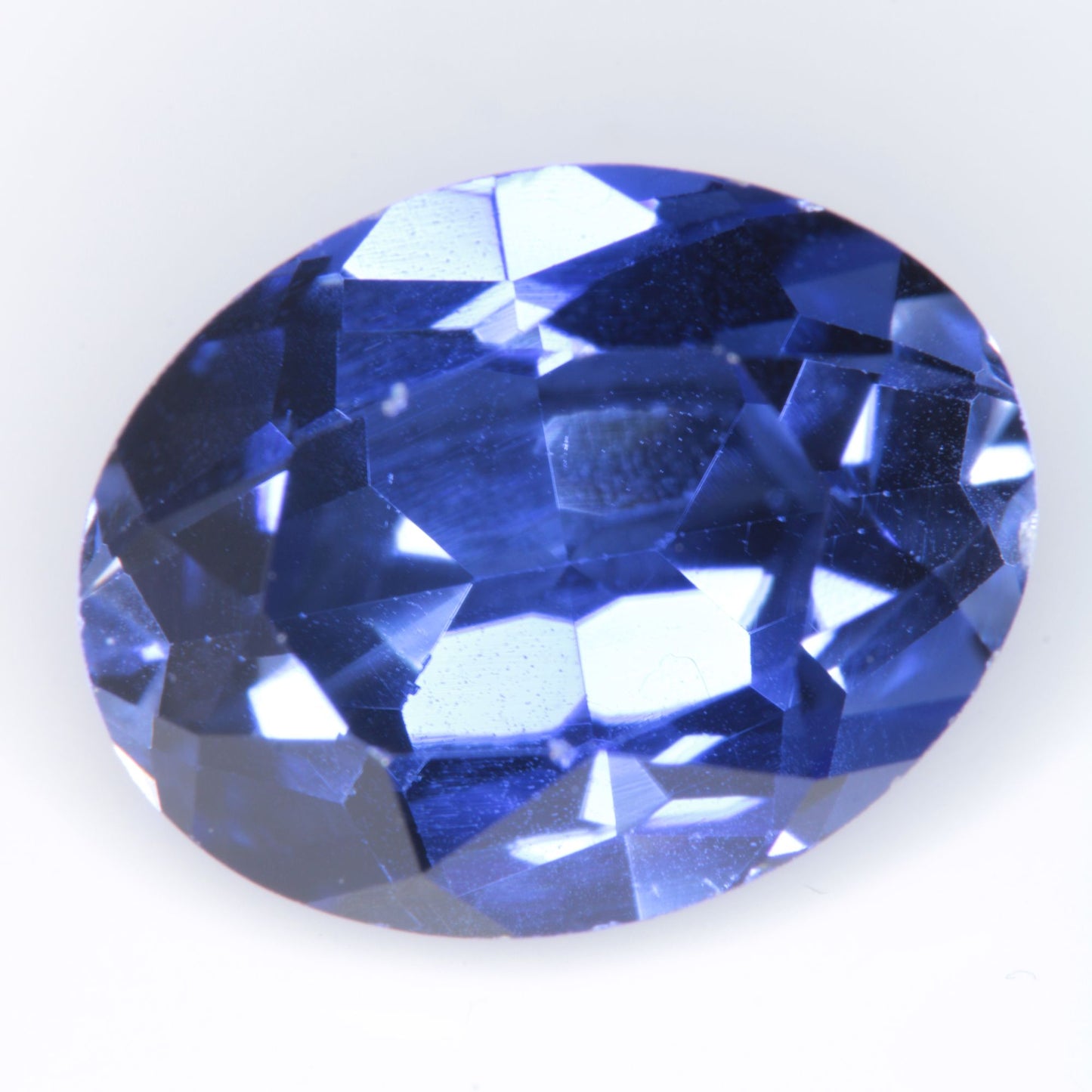 Faceted Flame Fusion Blue Sapphire Oval Gemstone