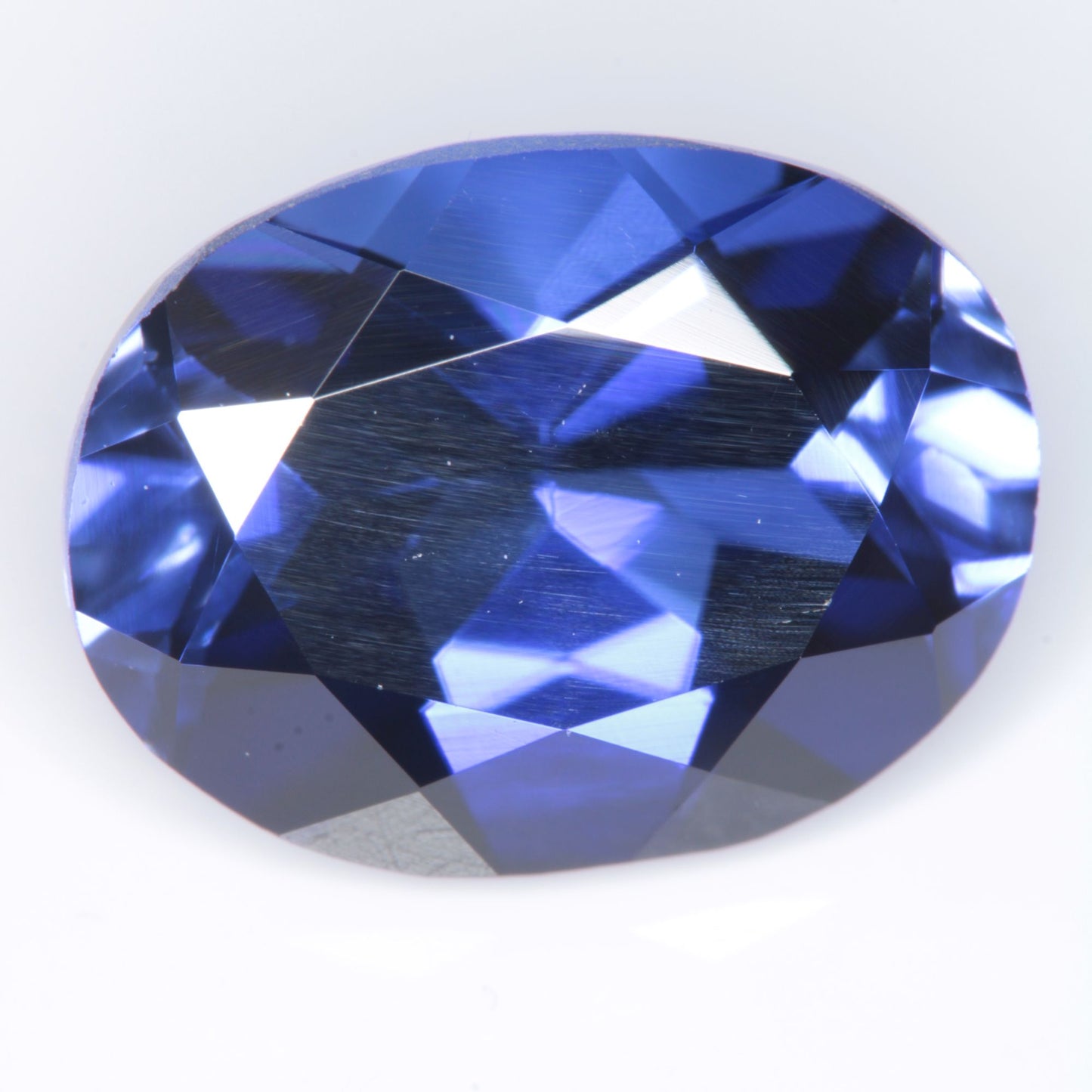 Faceted Flame Fusion Blue Sapphire Oval Gemstone