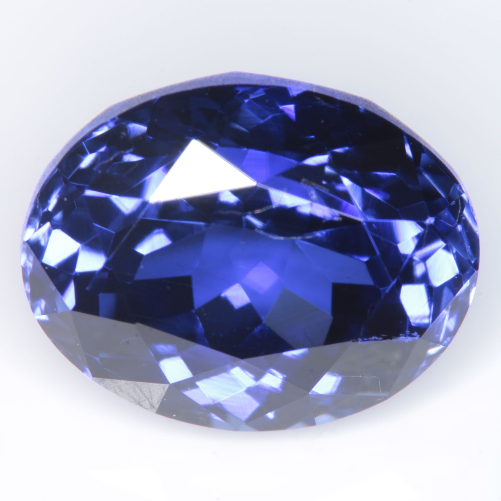 Faceted Flame Fusion Blue Sapphire Oval Gemstone