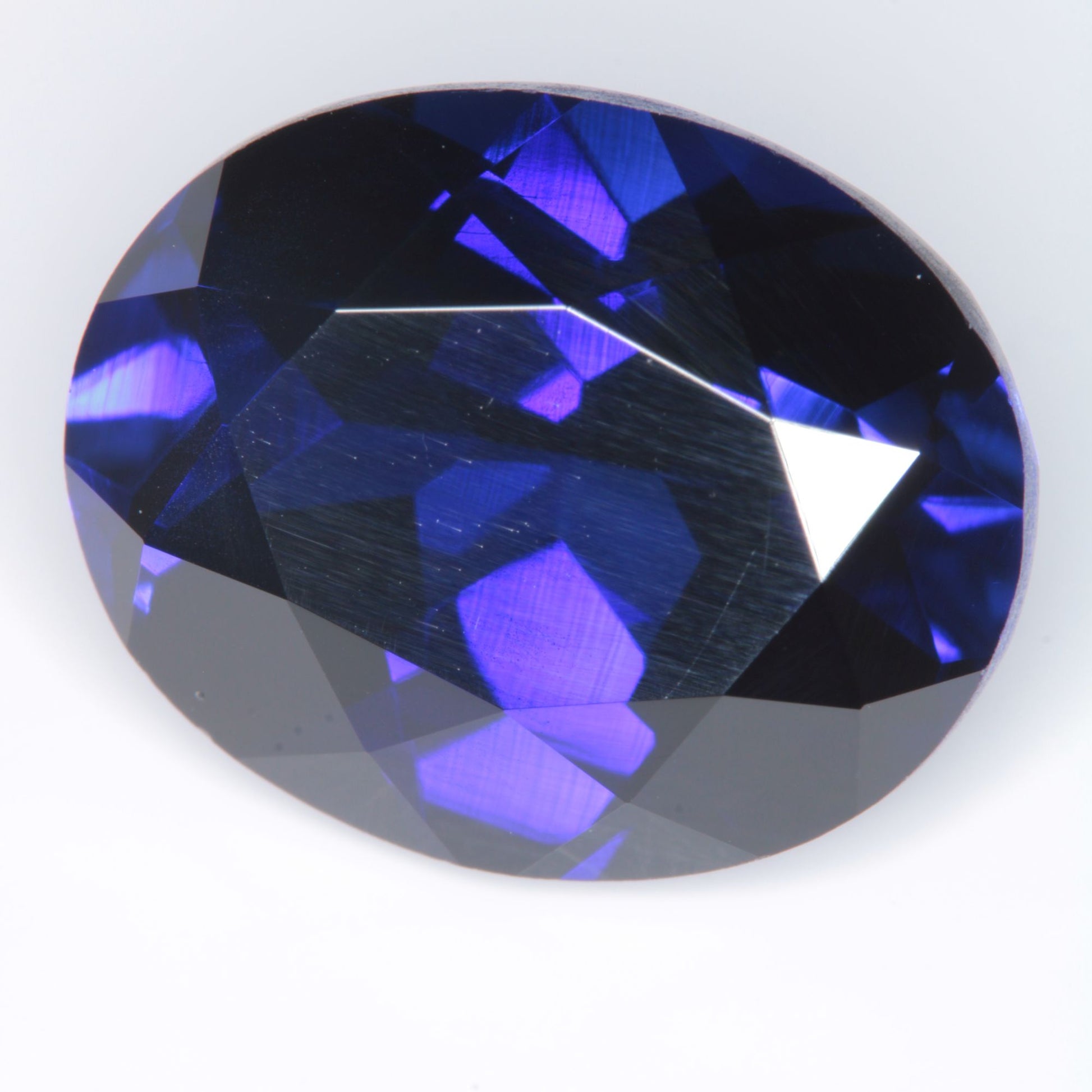 Faceted Flame Fusion Blue Sapphire Oval Gemstone