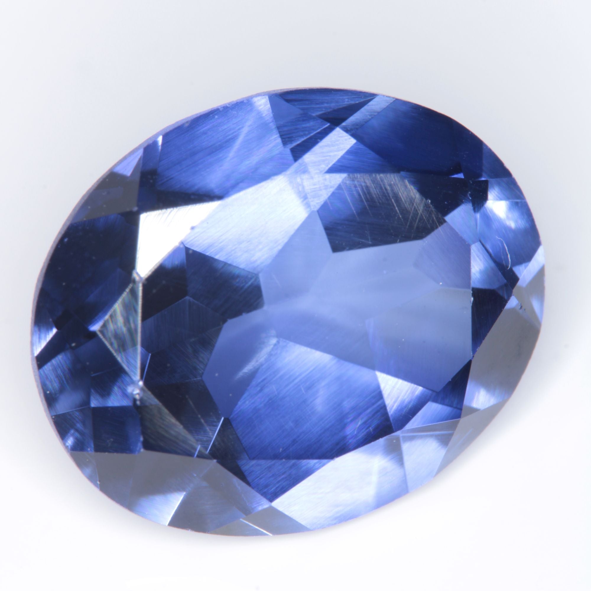 Faceted Flame Fusion Blue Sapphire Oval Gemstone