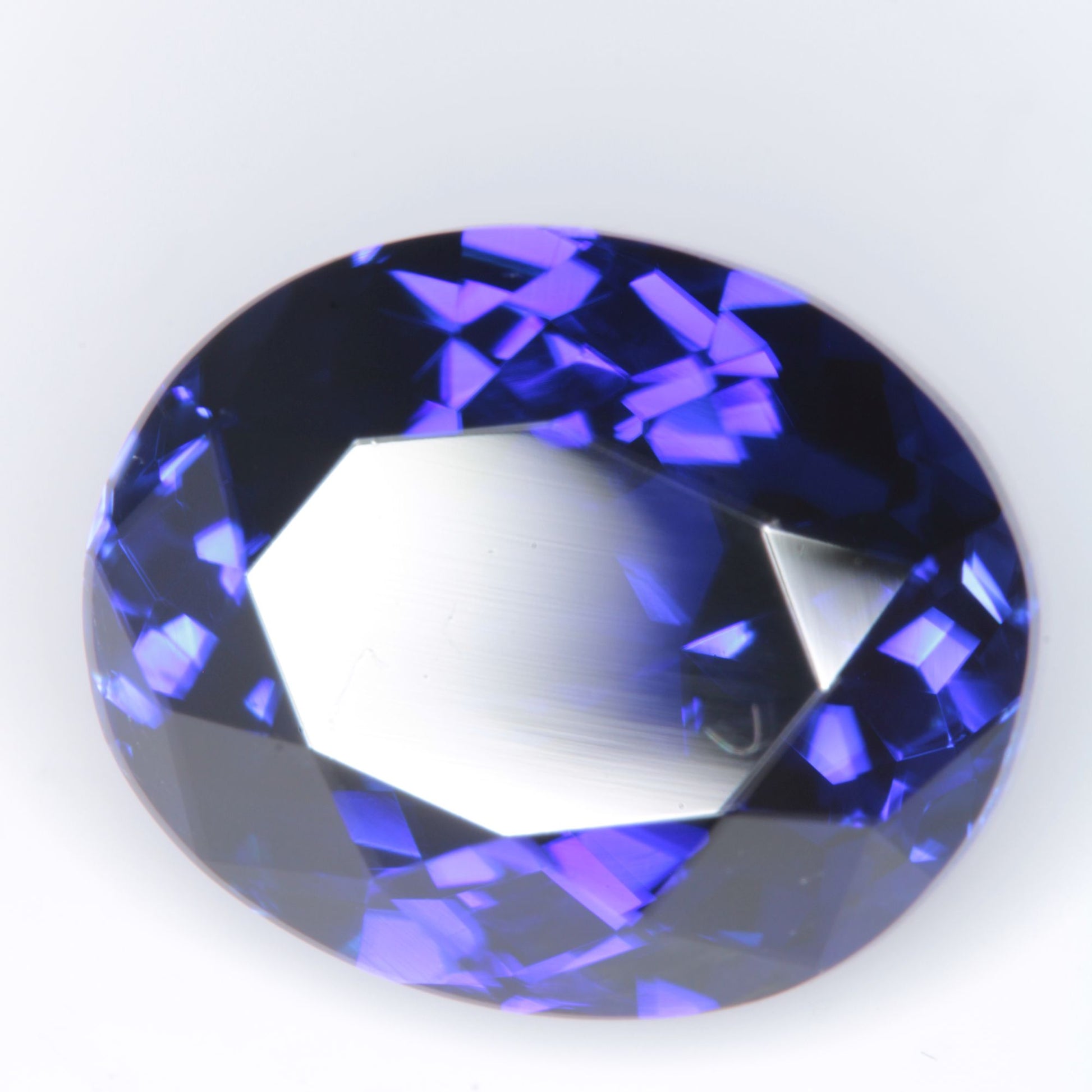 Faceted Flame Fusion Blue Sapphire Oval Gemstone