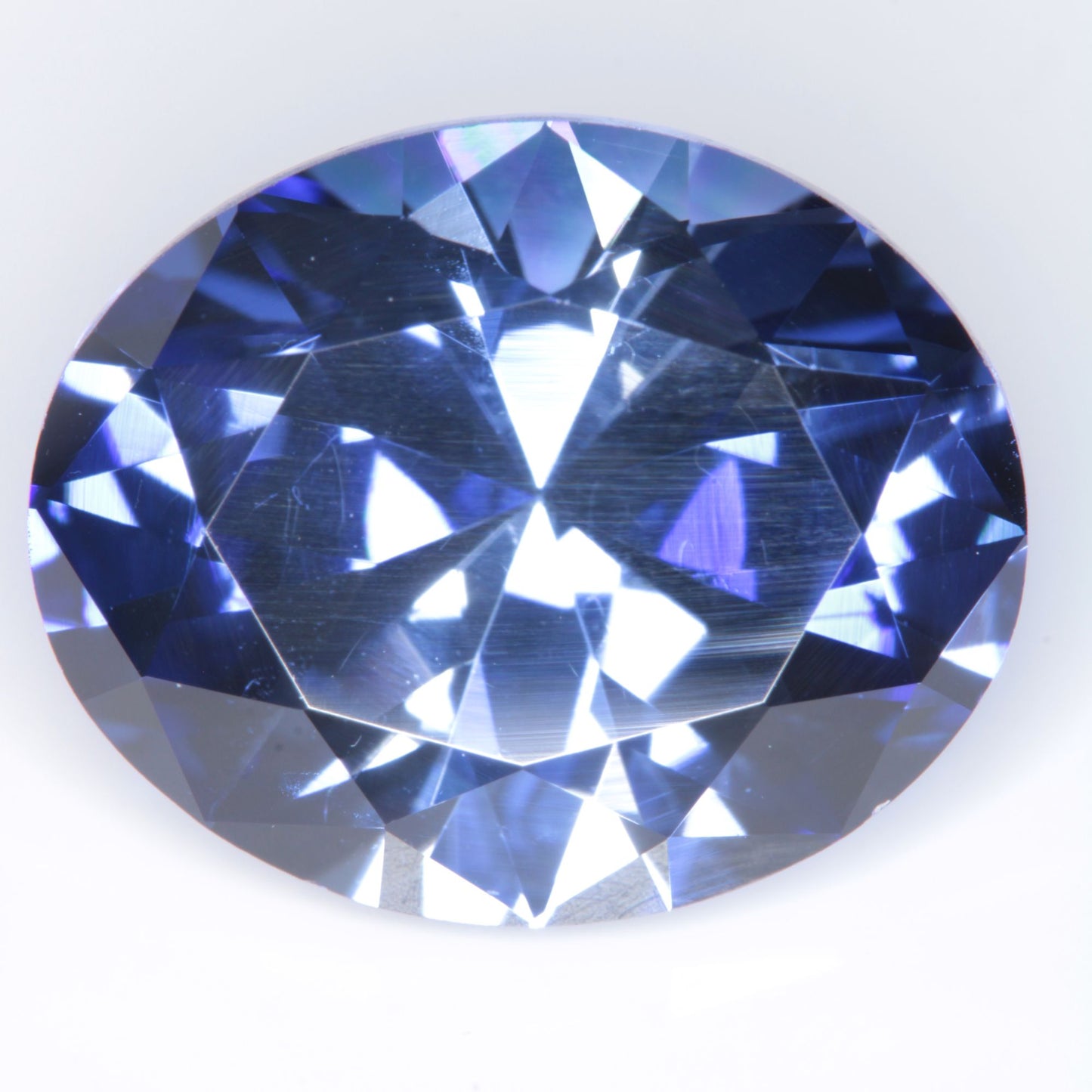 Faceted Flame Fusion Blue Sapphire Oval Gemstone