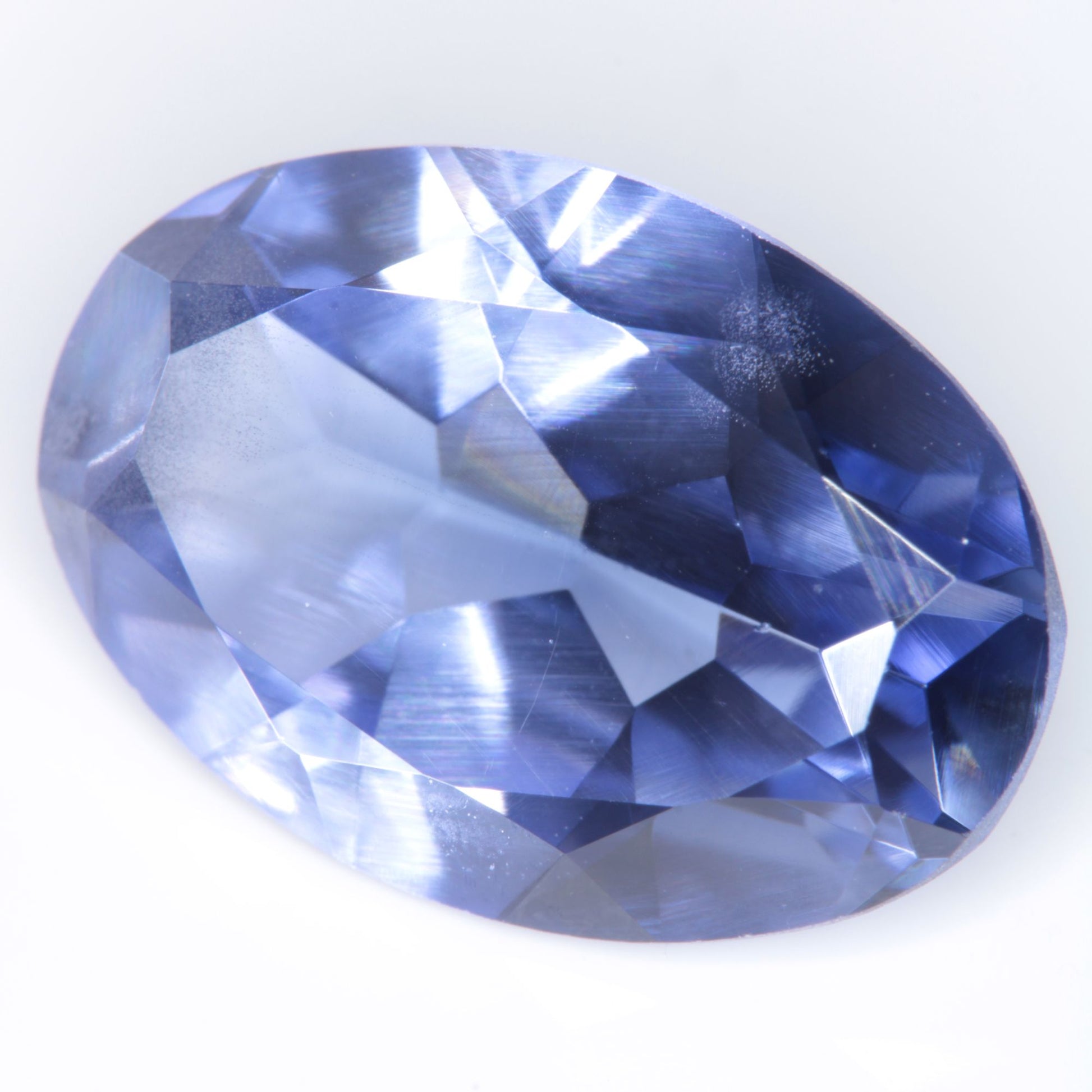 Faceted Flame Fusion Blue Sapphire Oval Gemstone