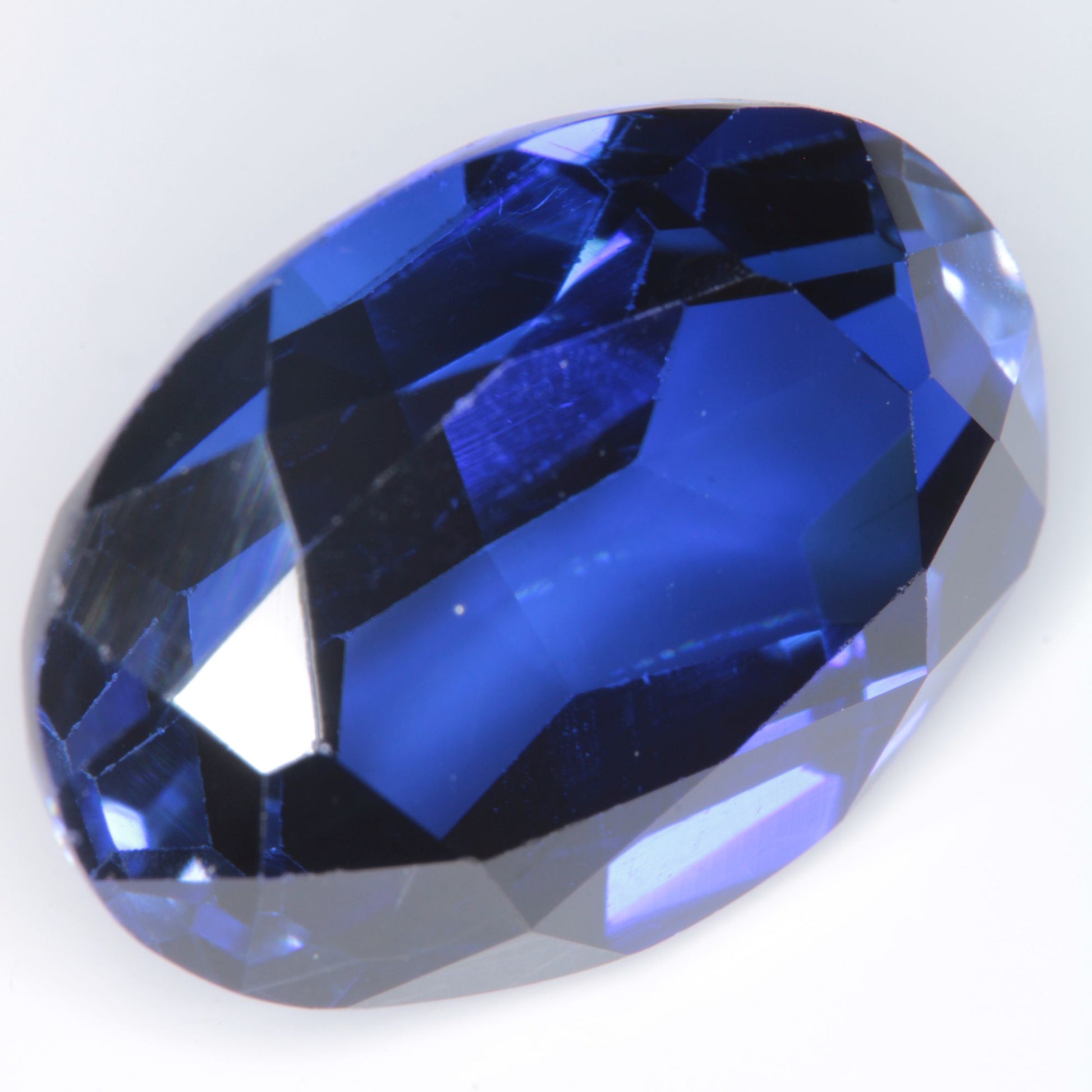Faceted Flame Fusion Blue Sapphire Oval Gemstone
