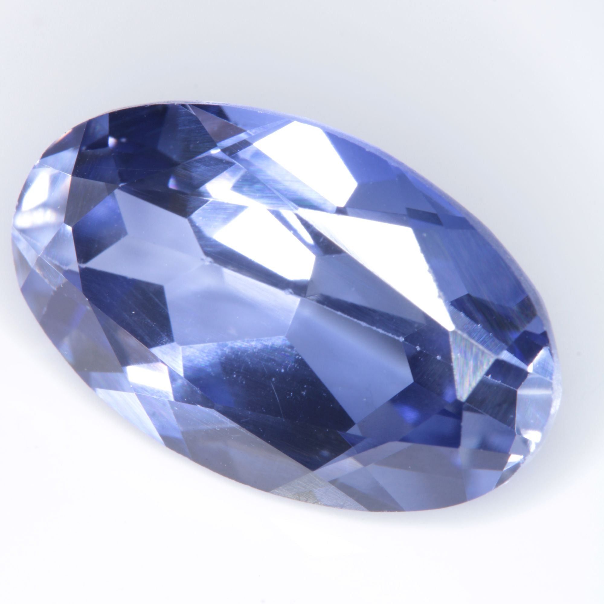 Faceted Flame Fusion Blue Sapphire Oval Gemstone