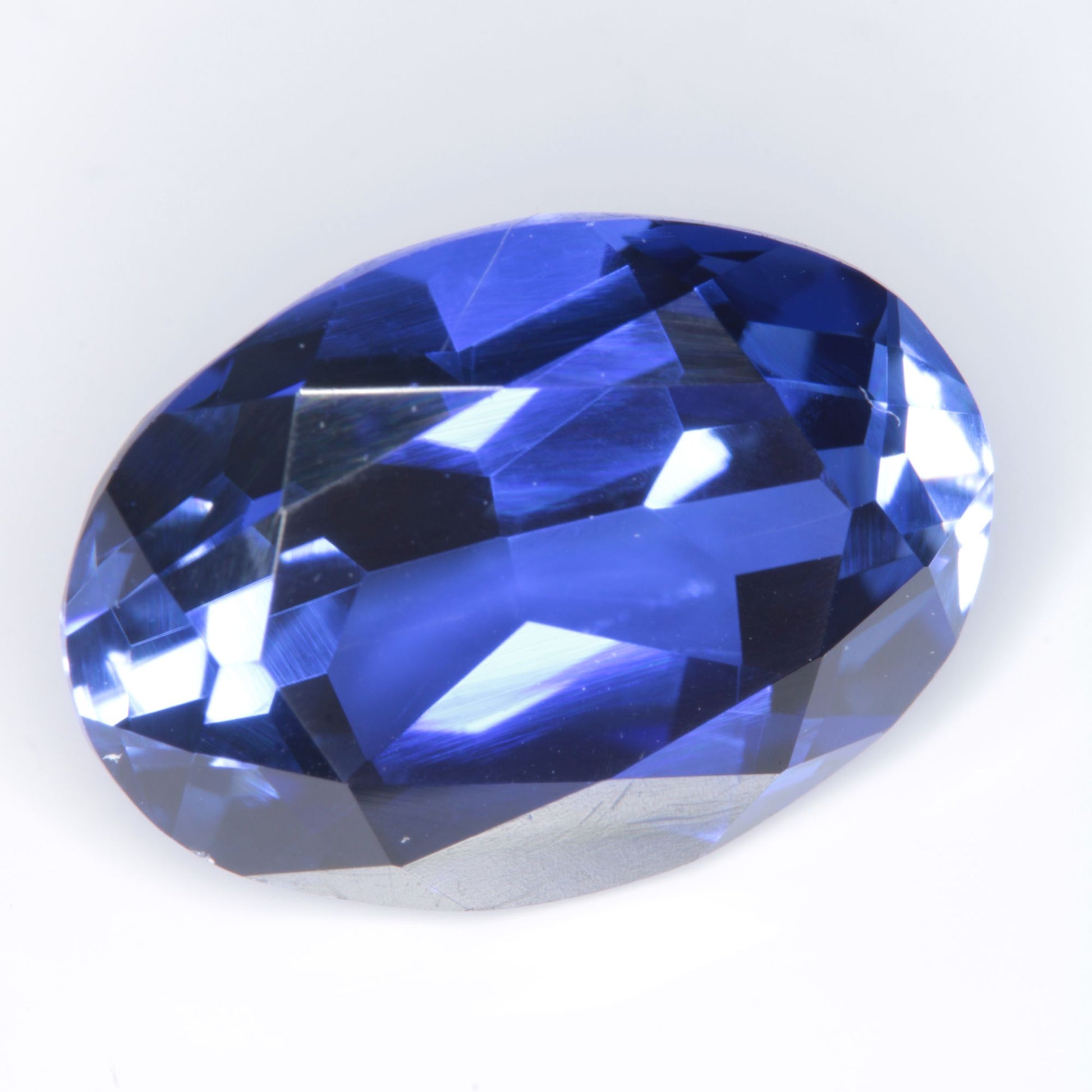 Faceted Flame Fusion Blue Sapphire Oval Gemstone