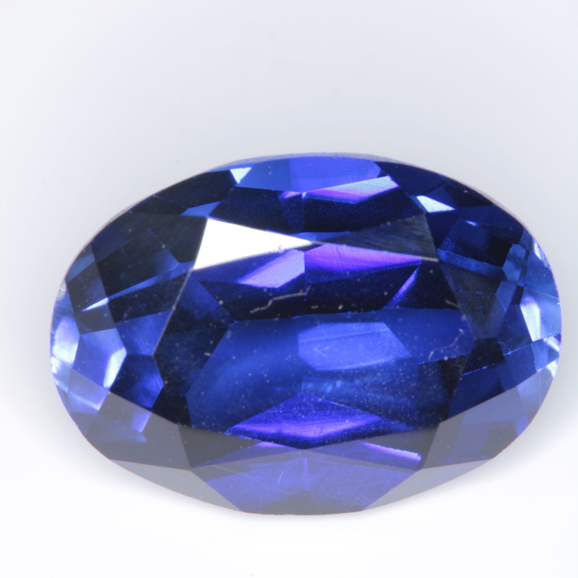 Faceted Flame Fusion Blue Sapphire Oval Gemstone
