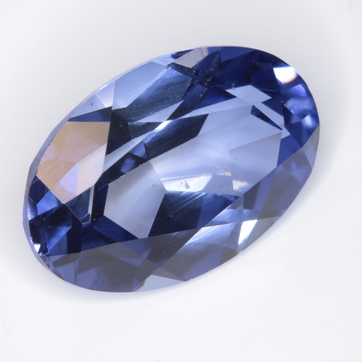 Faceted Flame Fusion Blue Sapphire Oval Gemstone