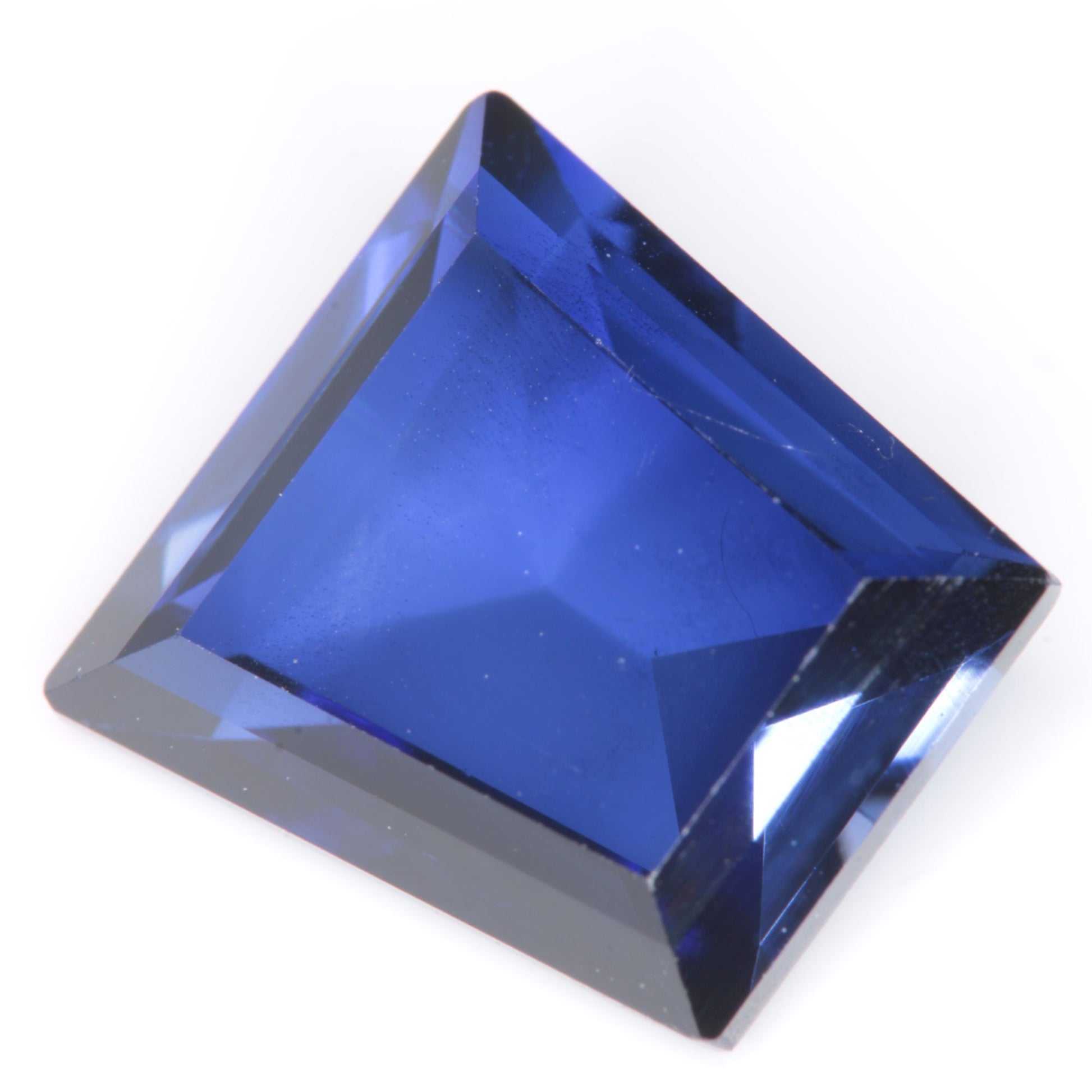 Faceted Flame Fusion Blue Sapphire Trapezoid Gemstone