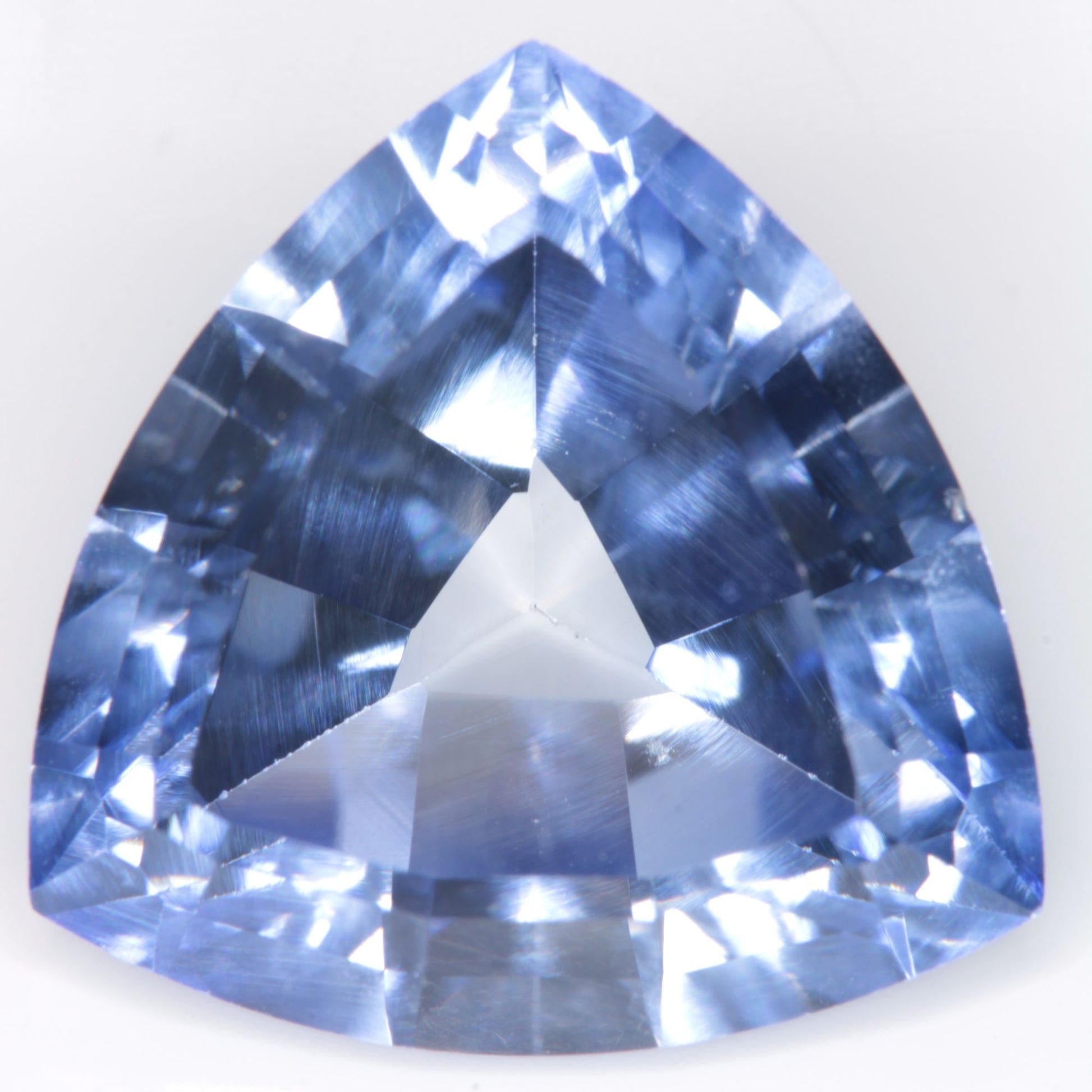 Faceted Flame Fusion Blue Sapphire Trillion Gemstone