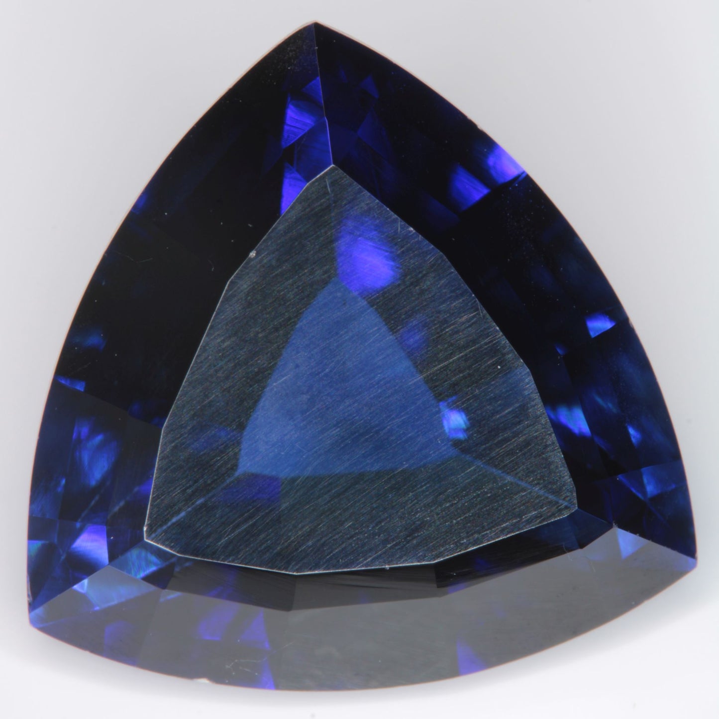 Faceted Flame Fusion Blue Sapphire Trillion Gemstone