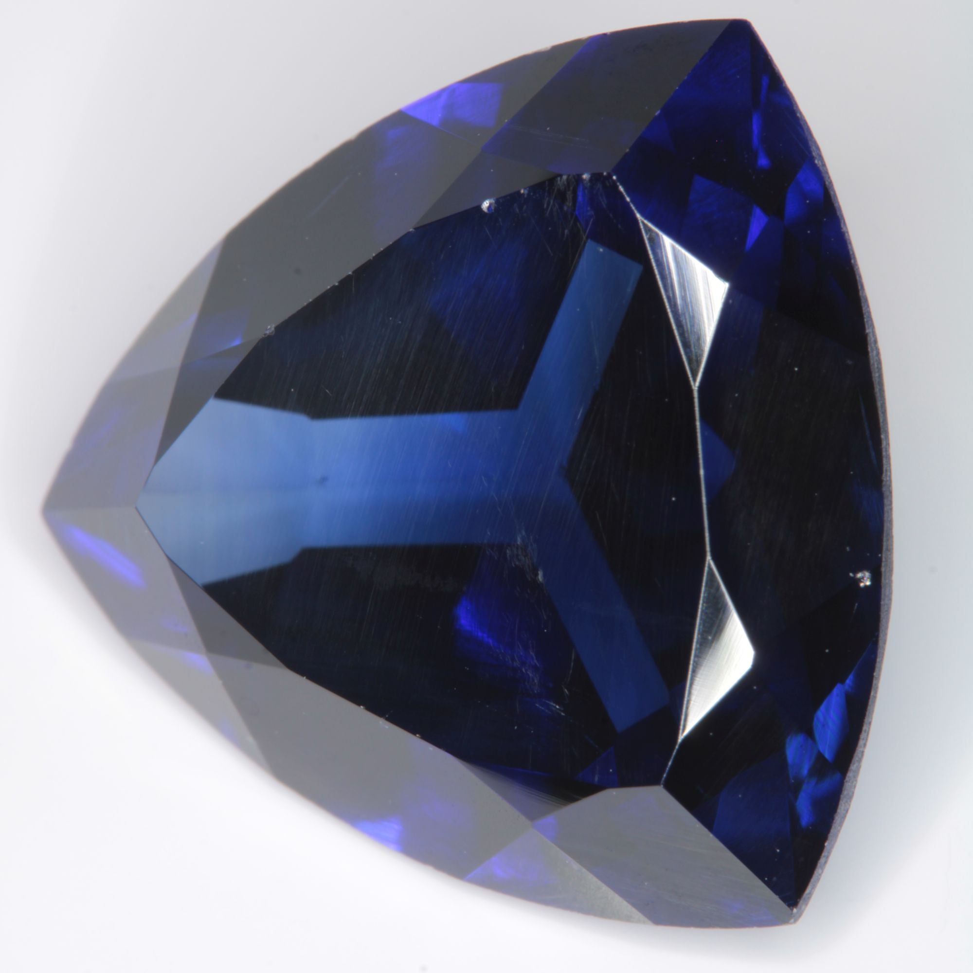 Faceted Flame Fusion Blue Sapphire Trillion Gemstone
