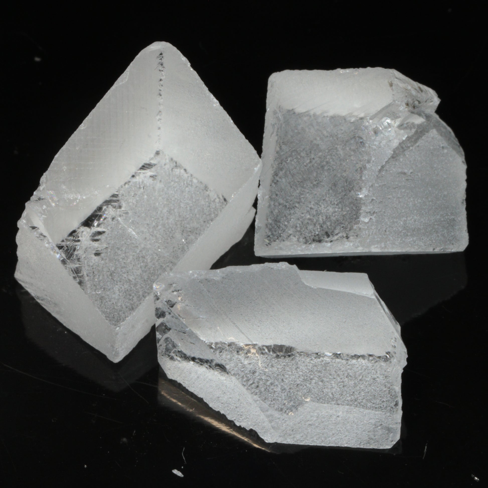 Faceted Labmade Fluorite under normal LED lighting, showing that it is colorless