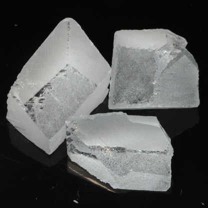 Faceted Labmade Fluorite under normal LED lighting, showing that it is colorless