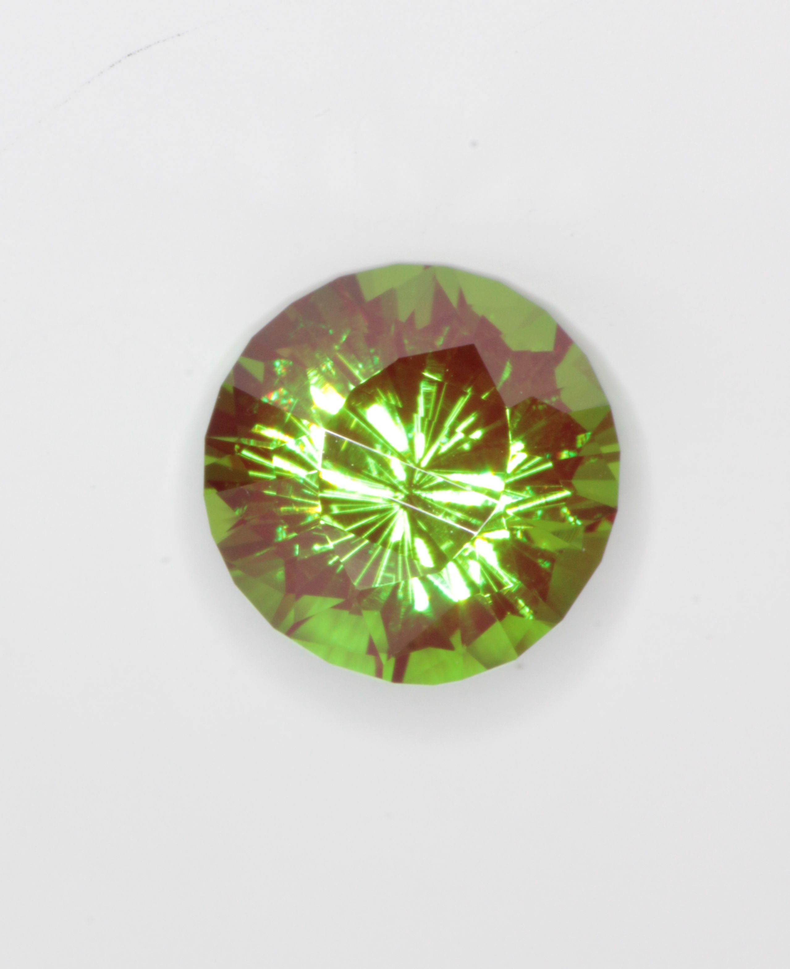 Cr3+ YAG faceted in a dragon eye pattern.\