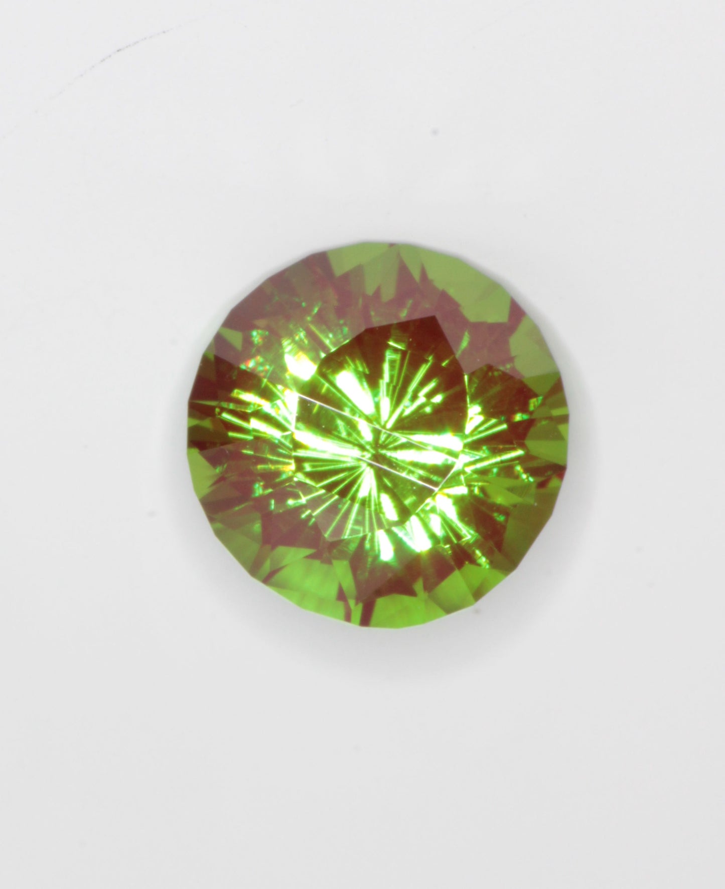Cr3+ YAG faceted in a dragon eye pattern.\