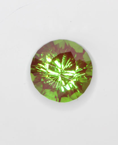 Cr3+ YAG faceted in a dragon eye pattern.\