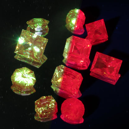 Loose Christmas Garnet Gemstones, Chromium Xmas Garnets, photo split to show red fluorescence under UV and normal color range