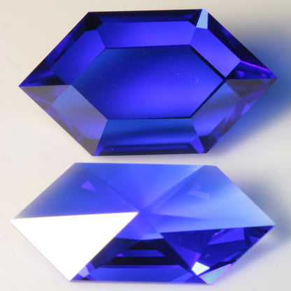 Comparison of original vs remake rupee designs, cut in blue spinel