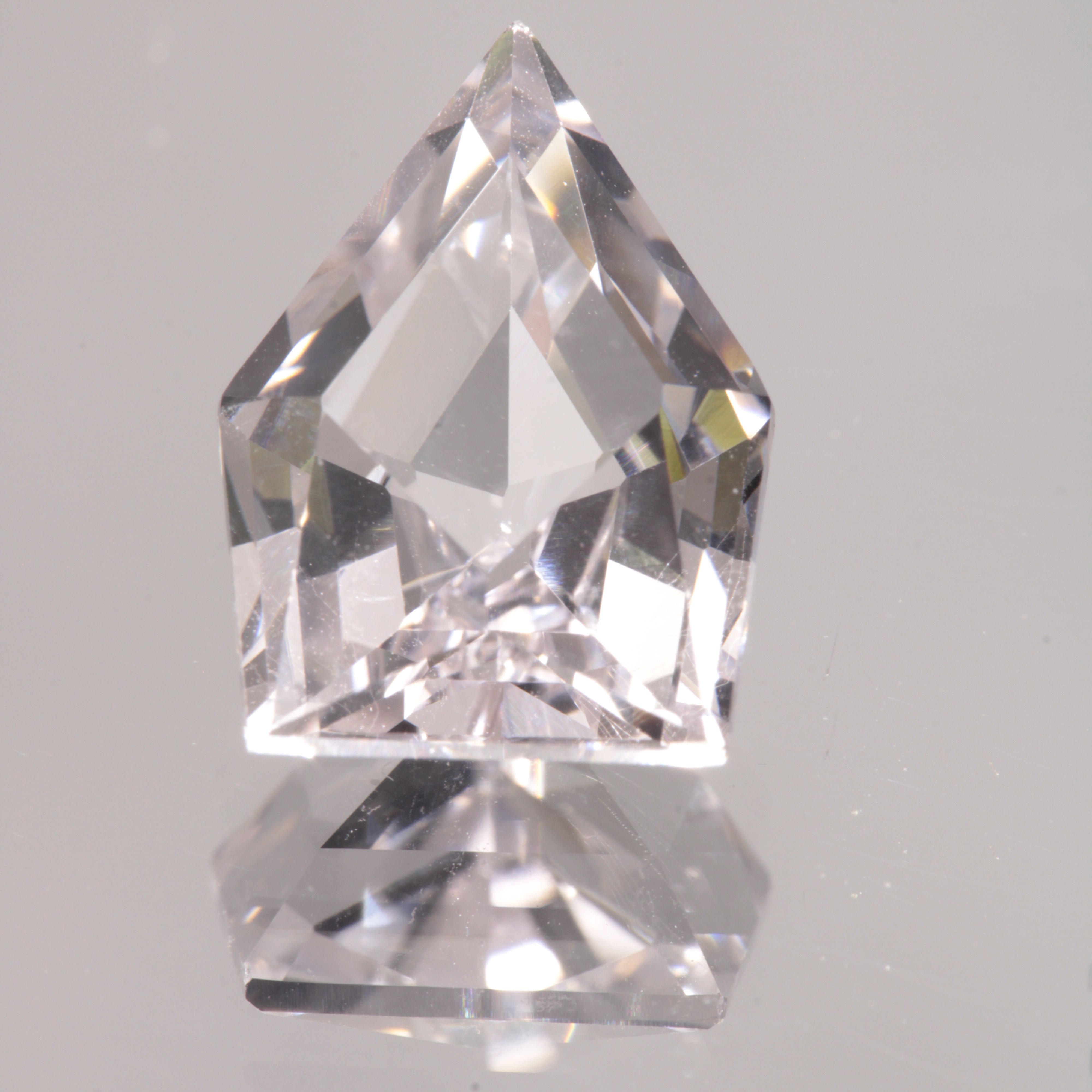 faceted Pink EOTS Cut sapphire gem made from F-35 window sapphire
