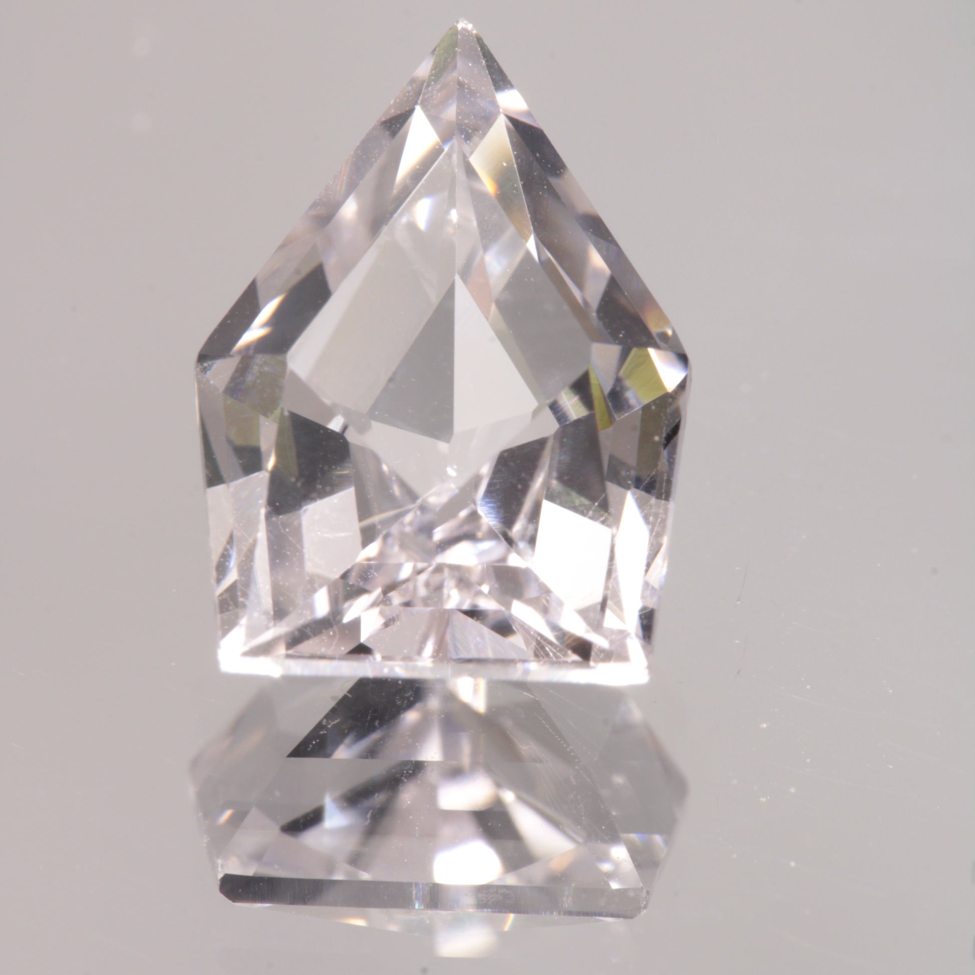 faceted Pink EOTS Cut sapphire gem made from F-35 window sapphire