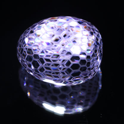 Faceted Nd:YAG Egg With Frosted Edges Gemstone on a black Background