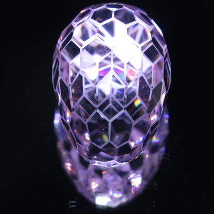 Faceted Nd:YAG Long Egg with Frosted Edges Gemstone on a black Background