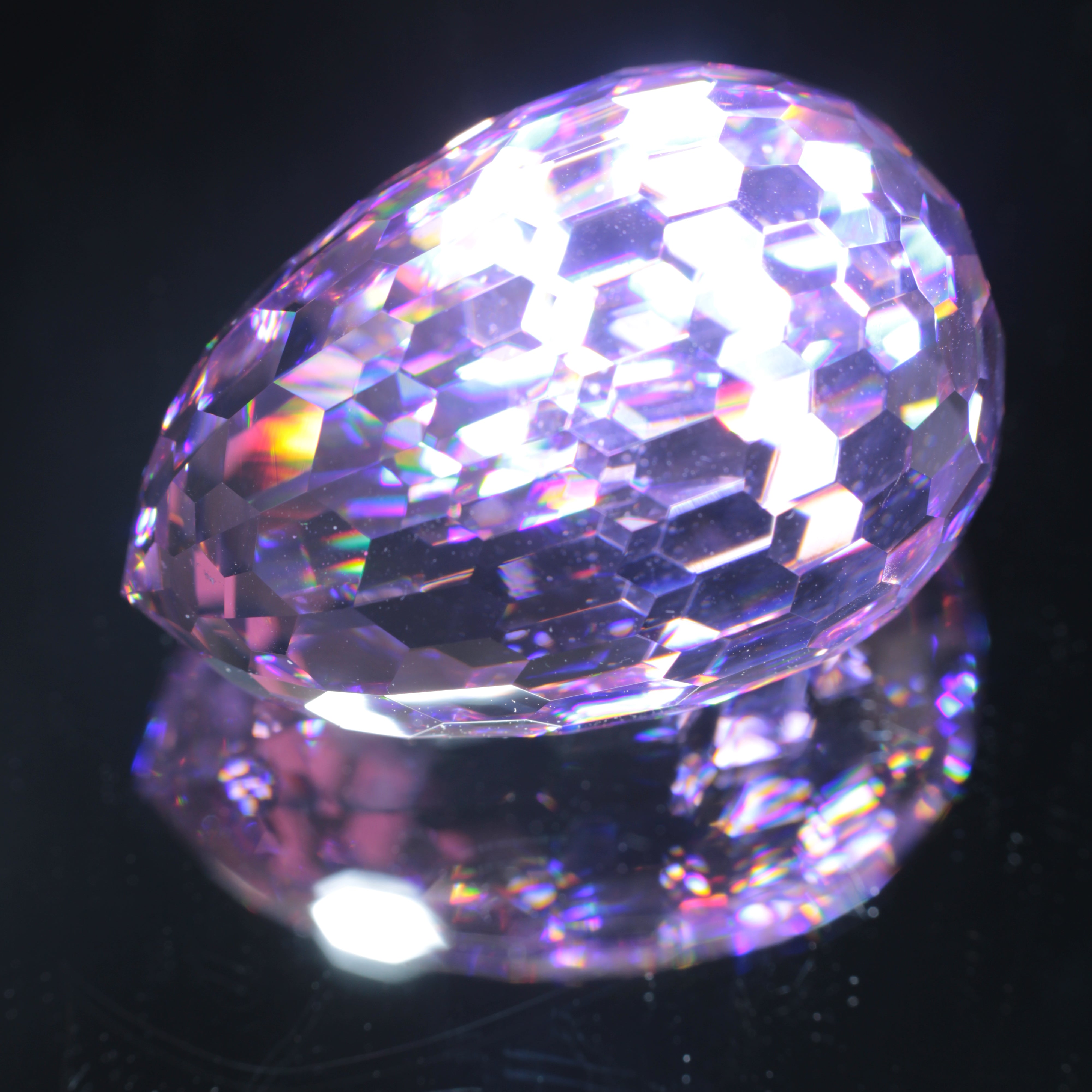 Faceted Nd:YAG Long Egg Gemstone on a black Background