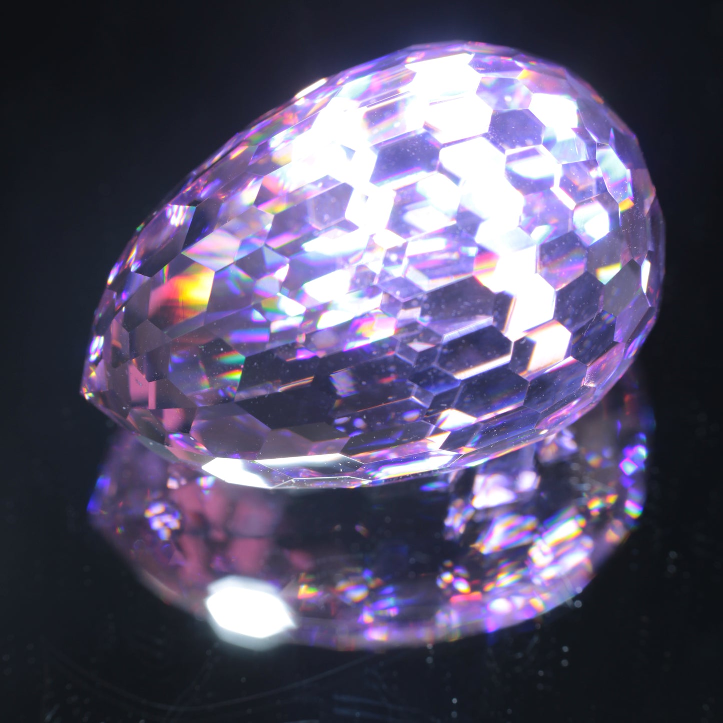 Faceted Nd:YAG Long Egg Gemstone on a black Background