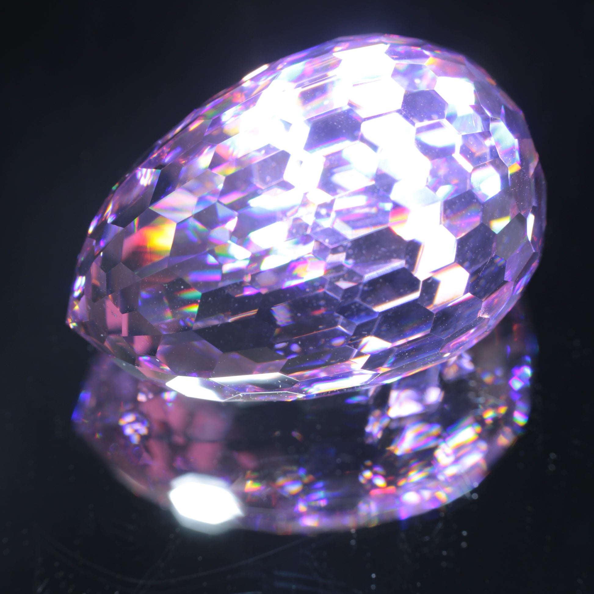 Faceted Nd:YAG Long Egg Gemstone on a black Background